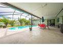 Relaxing pool area with covered patio, table and chairs, great for outdoor entertaining at 961 Whisler Ct, St Cloud, FL 34769
