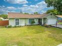 Light green house with two car garage at 961 Whisler Ct, St Cloud, FL 34769