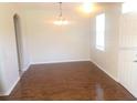 Simple dining room with hardwood floors and chandelier at 2884 Grasmere View Pkwy, Kissimmee, FL 34746