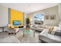 Bright living room with comfy sectional sofa and accent chair at 880 Pebble Beach Dr, Davenport, FL 33896