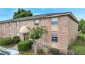 Brick building exterior with landscaping and parking at 440 Banyon Tree Cir # 102, Maitland, FL 32751