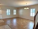 Spacious dining room with tile floors and large windows at 108 Colonial Pine Ln, Minneola, FL 34715