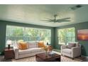 Bright living room with comfy seating and large windows at 1116 Madrid Ave, Daytona Beach, FL 32114