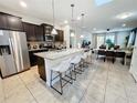 Modern kitchen with stainless steel appliances and an island at 1921 Nice Ct, Kissimmee, FL 34747