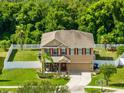 Two-story house with fenced yard and driveway at 108 Colonial Pine Ln, Minneola, FL 34715