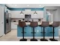 Modern kitchen with white cabinets and granite island at 3725 Pacific Ln, Davenport, FL 33897
