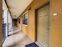 Residential hallway with doors to individual units at 12538 Floridays Resort Dr # C-211, Orlando, FL 32821