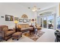Spacious living room with comfy wicker furniture at 220 Lewis Dr, Davenport, FL 33837