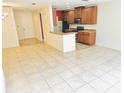 Open living and kitchen area with tile flooring throughout at 3152 Via Otero Dr, Kissimmee, FL 34744