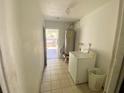 Laundry room with washer, dryer, and access to backyard at 316 Pennsylvania Ave, Saint Cloud, FL 34769
