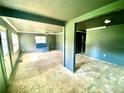 Large living room with dark gray walls, ceiling fan and bench at 316 Pennsylvania Ave, Saint Cloud, FL 34769