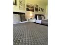 Bedroom with a queen bed, featuring stylish decor at 5245 W Irlo Bronson Memorial Hwy # 234, Kissimmee, FL 34746