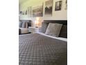 Bedroom with a queen bed, featuring stylish decor at 5245 W Irlo Bronson Memorial Hwy # 234, Kissimmee, FL 34746