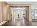 Bright and spacious entryway with modern wood features and a stunning chandelier at 15620 Panther Lake Dr, Winter Garden, FL 34787