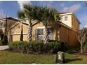 Two-story house with attached garage and palm trees at 5265 Oakbourne Ave, Davenport, FL 33837