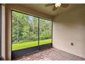 Screened porch overlooking backyard greenery at 790 Shady Canyon Way, Poinciana, FL 34759