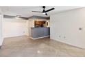 Open living area with tile floors and a ceiling fan at 3032 Parkway Blvd # 201, Kissimmee, FL 34747