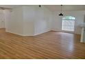 Bright dining area with light wood floors and large window at 1025 W Lake Hamilton Dr, Winter Haven, FL 33881