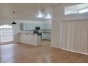 Modern kitchen with light blue cabinets and granite countertops at 1025 W Lake Hamilton Dr, Winter Haven, FL 33881