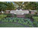 Formosa Gardens Estates entrance sign with festive holiday decorations at 7975 Sea Pearl Cir, Kissimmee, FL 34747