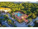 Resort-style pool and clubhouse with lush landscaping, offering a luxurious community atmosphere at 1370 Tuscan Ter # 2104, Davenport, FL 33896
