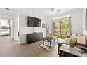 Open living area with flat-screen TV and access to patio at 1370 Tuscan Ter # 2104, Davenport, FL 33896