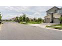 View of a gated community entrance with townhouses, showing the neighborhood's security and style at 9355 Sommerset Hills Dr # 9355, Davenport, FL 33896