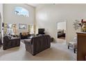 Spacious living room with high ceilings and views into the main bedroom at 241 Grosvenor Loop, Davenport, FL 33897