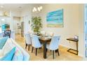 Elegant dining room with a large table and six chairs at 316 Treviso Dr, Poinciana, FL 34759