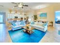Open living space with light flooring and blue accent rug at 316 Treviso Dr, Poinciana, FL 34759