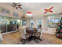 Sunroom with tiled floors and a round dining table at 117 Ridge View Dr, Davenport, FL 33837