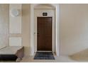 Private condo entry with security keypad and bench at 7671 Comrow St # 202, Kissimmee, FL 34747