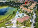 Community overview featuring pool, landscaping, and building location at 7671 Comrow St # 202, Kissimmee, FL 34747