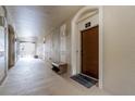 Condo hallway with private entry and bench at 7671 Comrow St # 202, Kissimmee, FL 34747