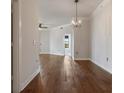 Bright dining room hardwood floors, chandelier at 501 Mirasol Cir # 424, Celebration, FL 34747