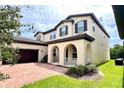 Beautiful two story home with arched entryway at 10091 Austrina Oak Loop, Winter Garden, FL 34787