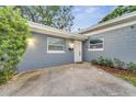 Front view of a newly renovated gray house at 1318 Terre Cia Ave, Orlando, FL 32807