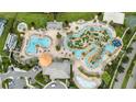 Aerial view of lazy river, pool, and mini golf at 4721 Clock Tower Dr # 302, Kissimmee, FL 34746