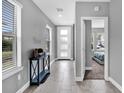 Bright entryway with tile flooring and access to bedroom at 4716 Terra Esmeralda Dr, Kissimmee, FL 34746