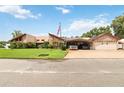 Mid-century modern home with a three-car garage at 50 2Nd St, Saint Cloud, FL 34769