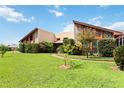 Mid-century modern home with lush landscaping at 50 2Nd St, Saint Cloud, FL 34769