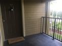 Private balcony with a welcoming mat and view of the surroundings at 2203 Key West Ct # 436, Kissimmee, FL 34741