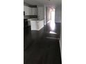 Open living area with dark hardwood floors at 15231 Honeybell Dr, Winter Garden, FL 34787