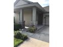 Inviting front porch entry with stone accents at 15231 Honeybell Dr, Winter Garden, FL 34787