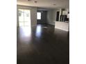 Spacious living area with hardwood floors and access to backyard at 15231 Honeybell Dr, Winter Garden, FL 34787