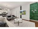 Living room with modern furniture and accent wall at 8968 Silver Pl, Kissimmee, FL 34747