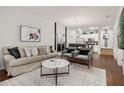 Open living room with modern decor and kitchen view at 8968 Silver Pl, Kissimmee, FL 34747