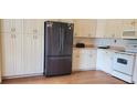 Kitchen with stainless steel appliances and white cabinets at 9549 Sw 53Rd Cir, Ocala, FL 34476