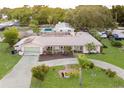 Single story home with pool and circular driveway at 1500 8Th Se St, Winter Haven, FL 33880