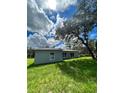 Rear view of new construction home with gray siding at 1339 Tallahassee Ct, Kissimmee, FL 34759